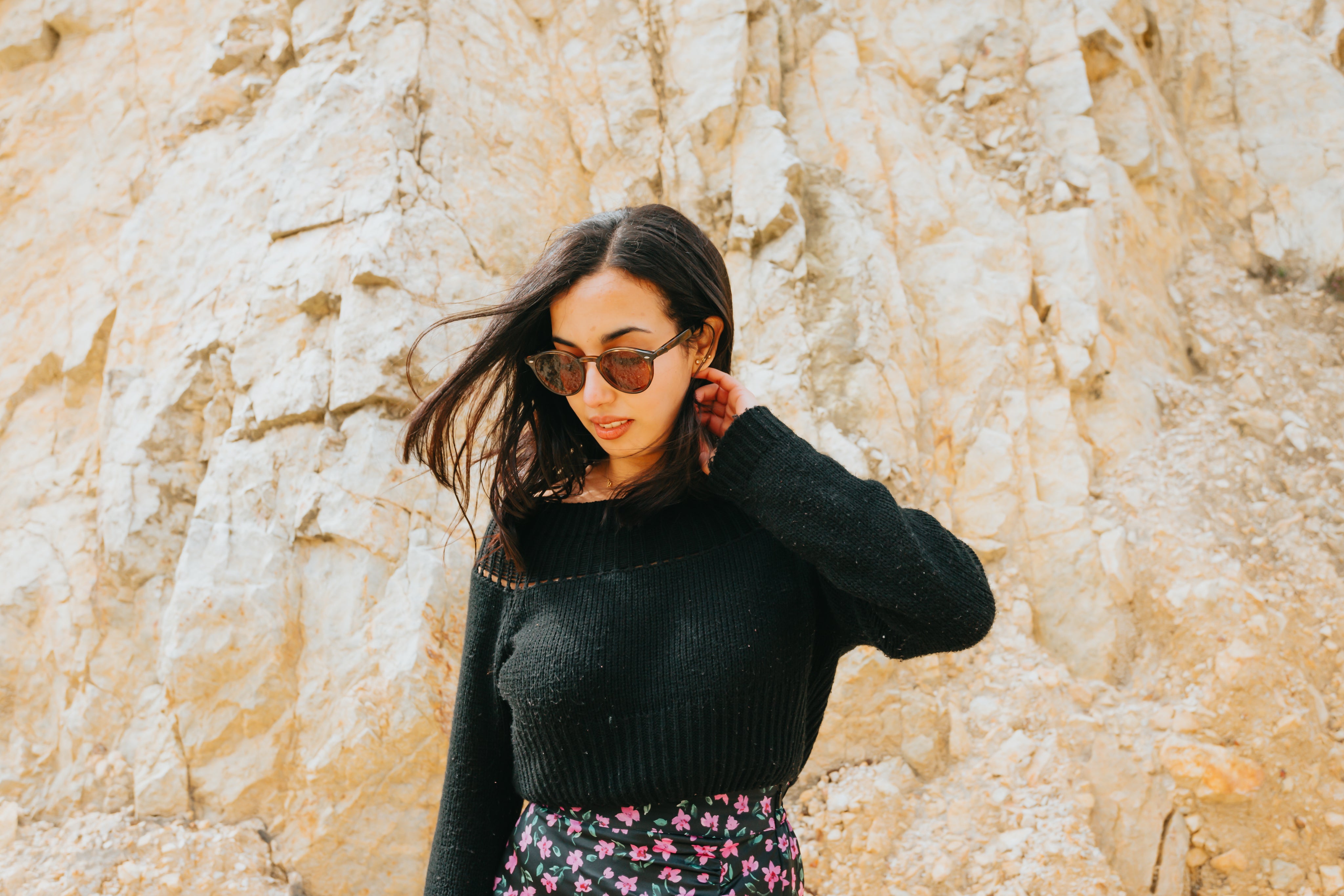 files/woman-standing-in-from-of-a-large-rocky-hill.jpg